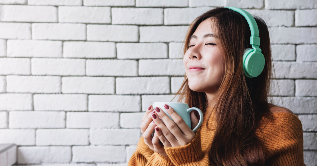    Woman relaxing while listening to music.